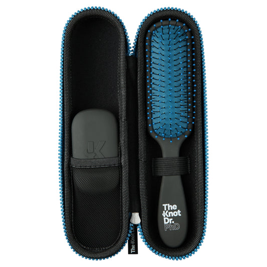 Slimline black detangling brush with blue pad inside our black protector case with Kleen tool