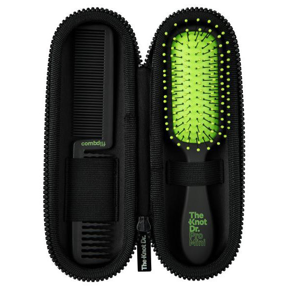 Mini black detangling brush with green pad inside our green protector case with comb