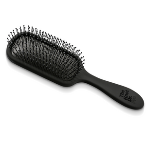 All black detangling hair brush lying flat