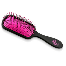 Load image into Gallery viewer, Pro detangling hairbrush in black with pink pad laying flat